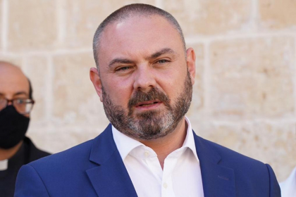 Minister denies role in controversial reinstatement